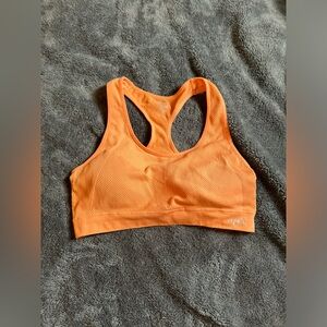 Lightly padded orange sports bra size large